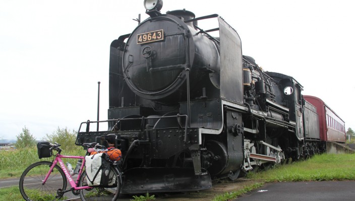 Old locomotiv train and my pink bike in Hokkaido, Japan